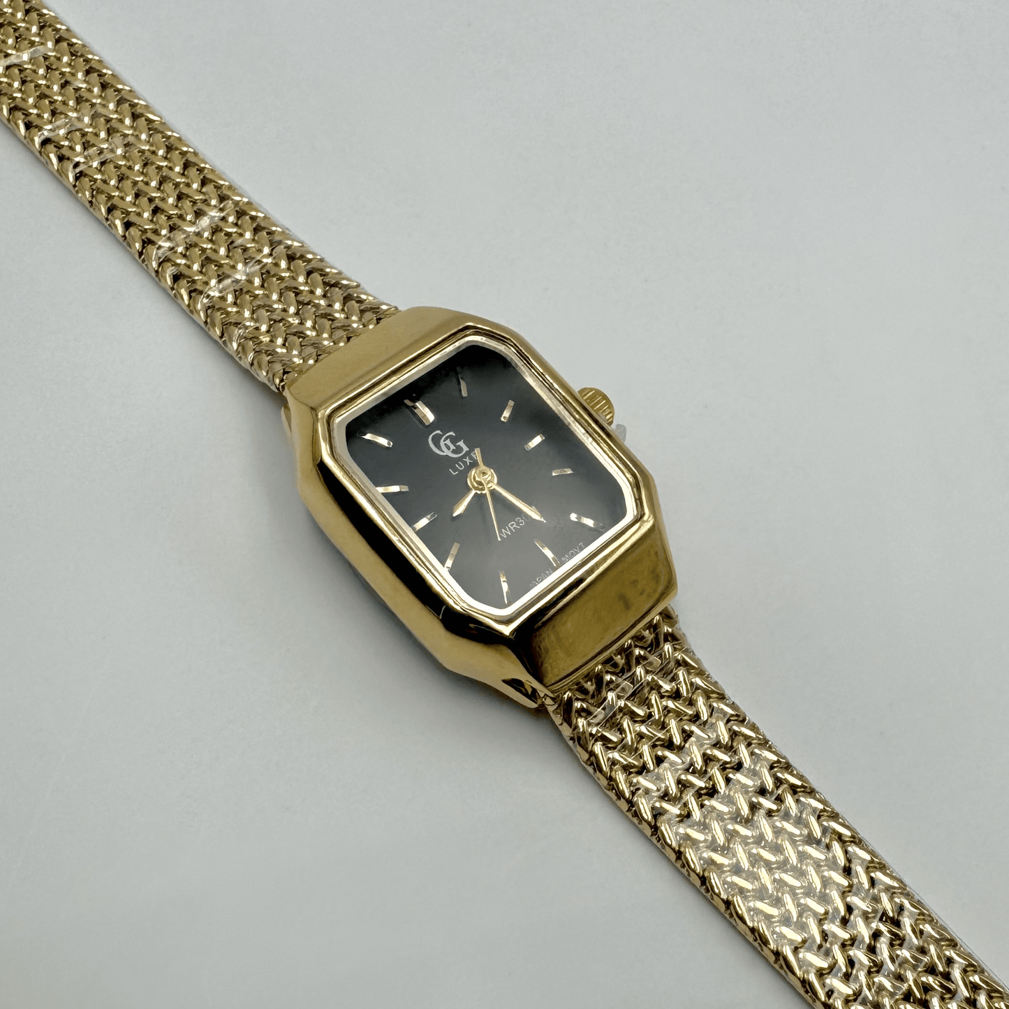 Montre femme dorée en acier inoxydable ajustable
