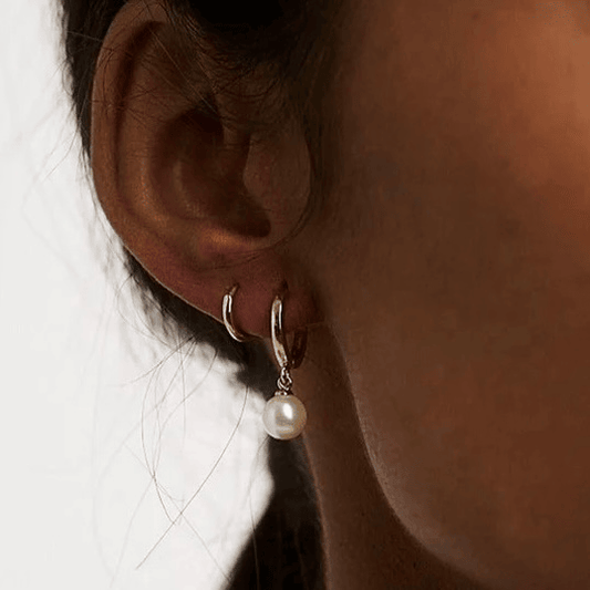 Mono boucles d’oreilles en acier inoxydable dorées 